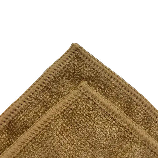 Detailansicht der hochwertigen Gewebestruktur des braunen Naturfasertuchs – nachhaltige Premium-Qualität.